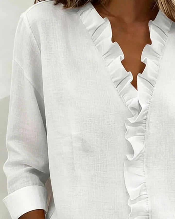 Aletta – Chic blouse with ruffles, V-neck and long sleeves